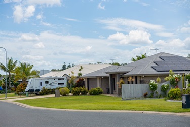 Two tidy, modern houses with neat front lawns