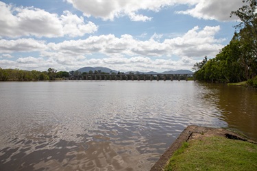 Looking out across the Fitzroy River, we see the Fitzroy Barrage and Mount Archer