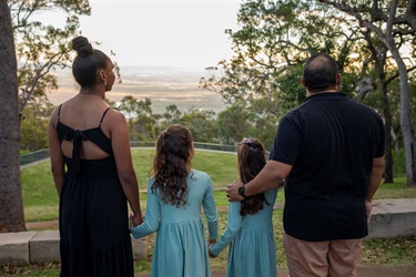 A family looks out over Rockhampton from the Mount Archer Nurim summit