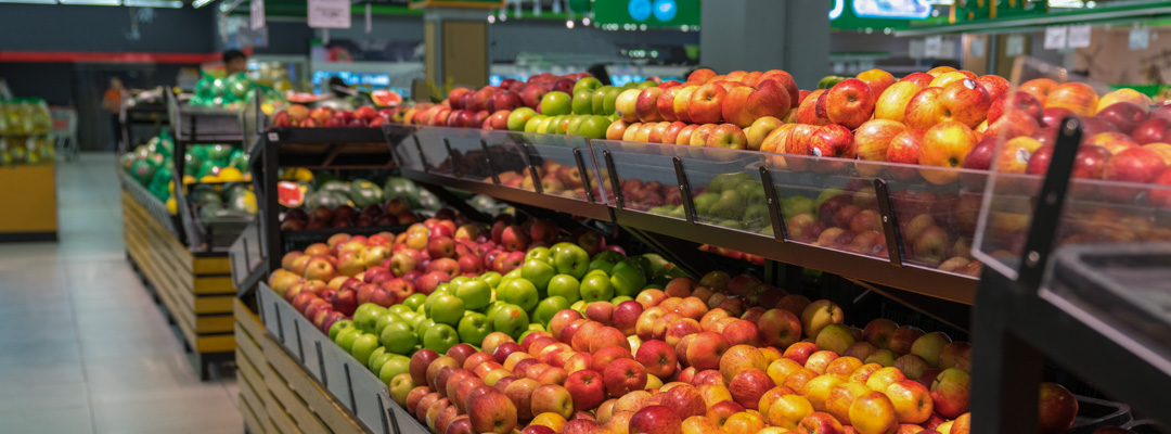 Rows of fresh produce on a supermarket shelf